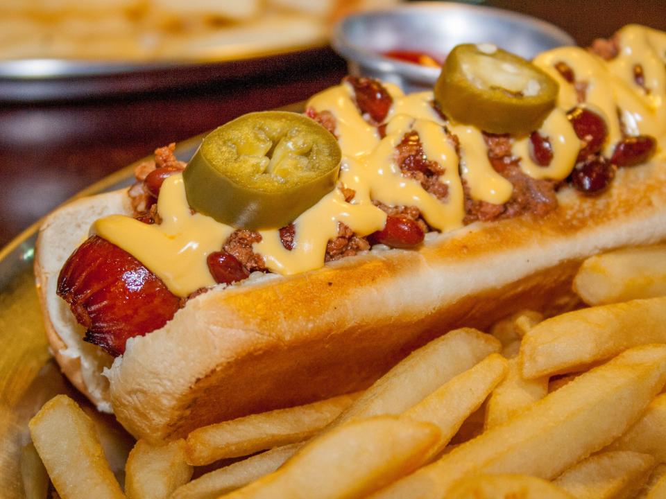 hot dog with chili, cheese, and sliced jalapeno