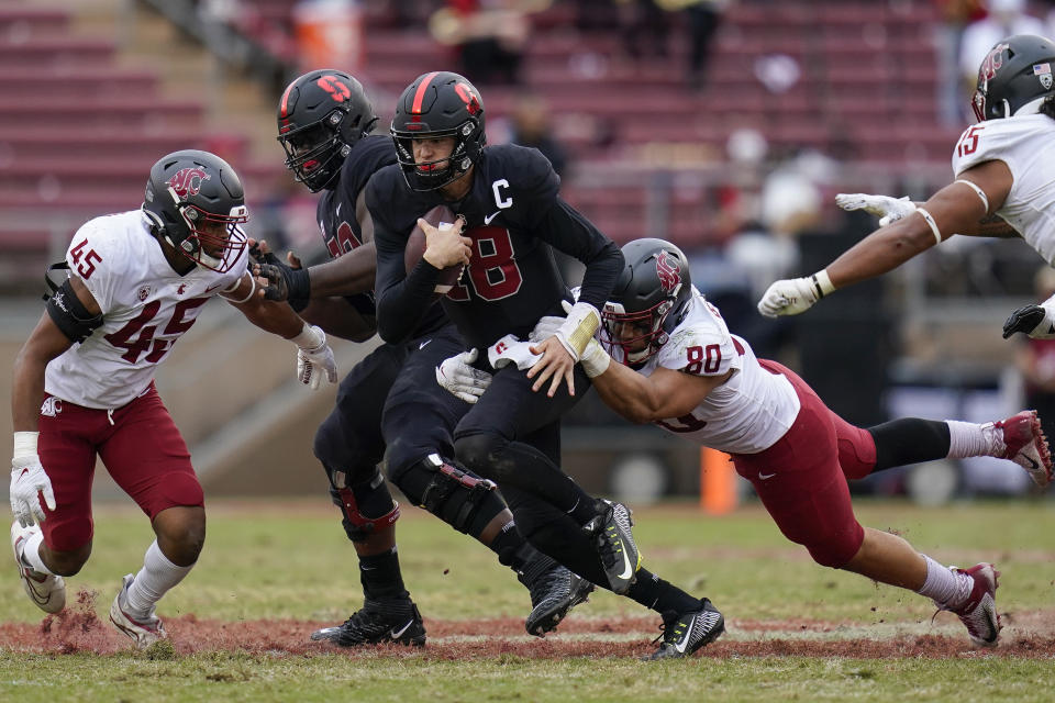 Washington State defensive end Brennan Jackson (80) tackles Stanford quarterback Tanner McKee (18) during the second half of an NCAA college football game in Stanford, Calif., Saturday, Nov. 5, 2022. (AP Photo/Godofredo A. Vásquez)