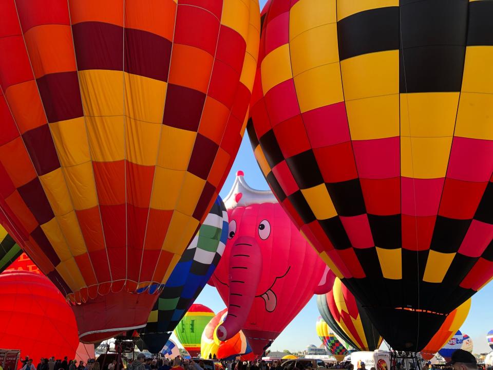 Hot air balloons are inflated during the annual Albuquerque International Balloon Fiesta in Albuquerque, N.M., on Saturday, Oct. 5, 2019. Organizers are expecting tens of thousands of spectators for opening weekend and exponentially more over the course of the nine-day event. (AP Photo/Susan Montoya Bryan)