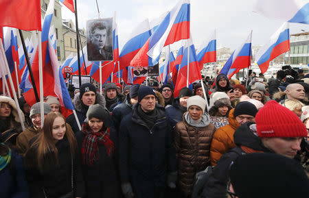 Russian opposition leader Alexei Navalny (C) attends a rally, which marks the third anniversary of opposition figure Boris Nemtsov's death, in Moscow, Russia February 25, 2018. REUTERS/Maxim Shemetov