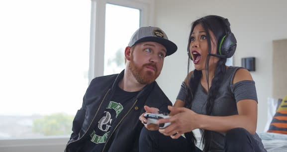 Influencer MissesMae (right) demos a Turtle Beach headset.