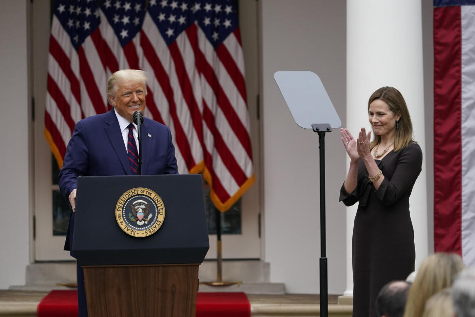 Judge Amy Coney Barrett applauds as President Donald Trump announces Barrett as his nominee to the Supreme Court, in the Rose Garden at the White House, Saturday, Sept. 26, 2020, in Washington. (AP Photo/Alex Brandon)