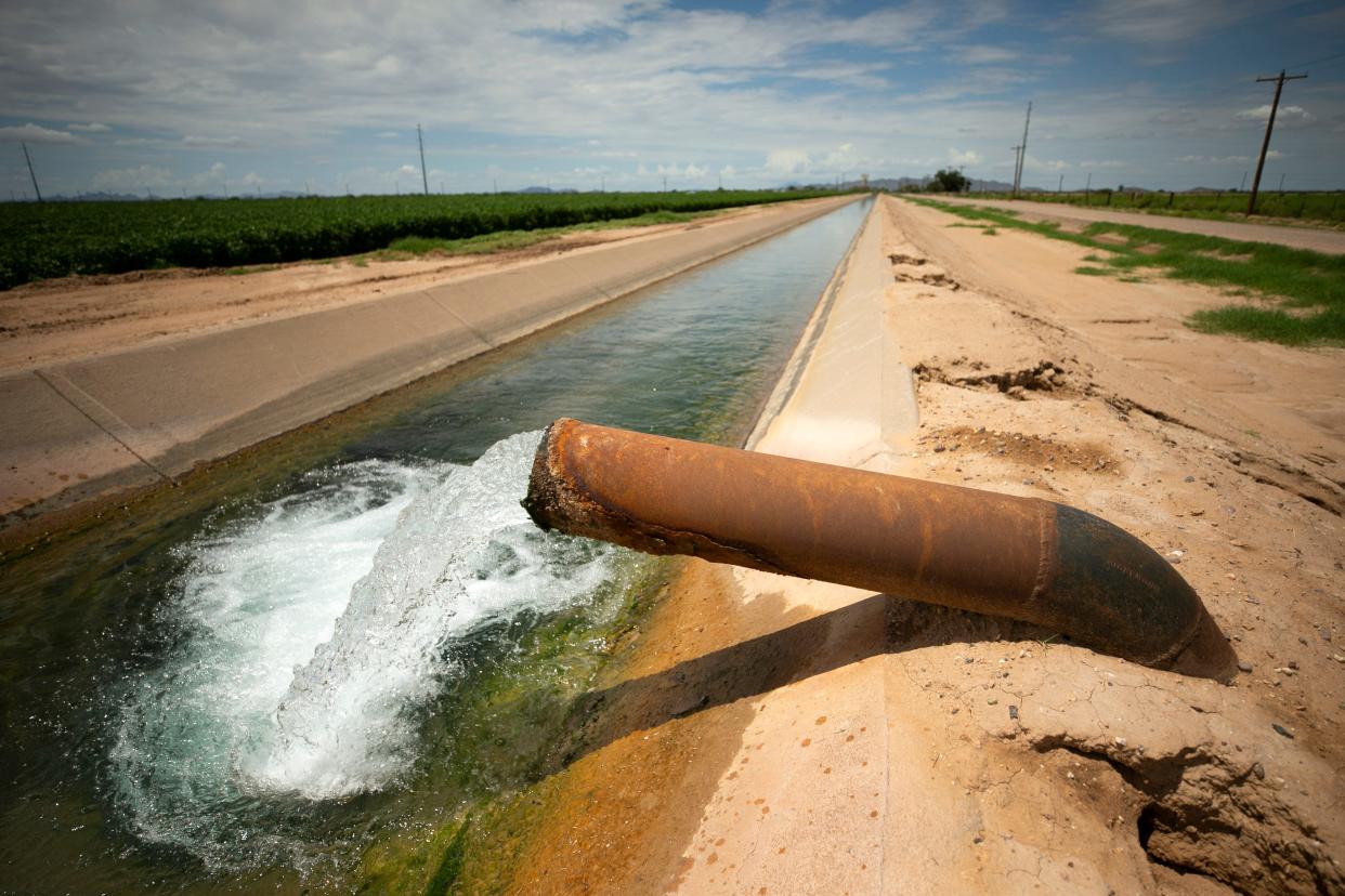 Groundwater flows into a canal outside of Casa Grande on Aug. 13, 2021. Farmers in the area will lose all Central Arizona Project water in 2023.