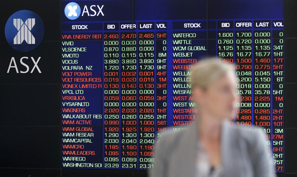 A woman walks through the viewing area at the Australian Stock Exchange in Sydney, Australia, Wednesday, May 1, 2019. Financial markets were mostly closed in Asia on Wednesday for holidays after Wall Street capped a wobbly trading session with meager gains. Australia's S&P ASX 200 rose 0.8% after ANZ reported a 2% increase in its profit, kicking off the earnings season for the country's Big Four banks. (AP Photo/Rick Rycroft)