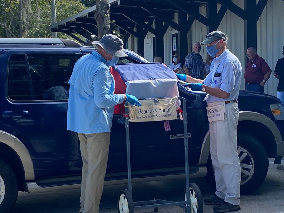 Election volunteers in Beaufort County, South Carolina, help a voter cast a curbside ballot.Photo by Griffin Connolly/The Independent