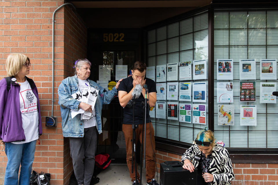 Deb Bailey (center), a co-founder of Moms Stop The Harm, lends a comforting hand to Jeremy Kalicum of the Drug User Liberation Front during a news conference on International Overdose Awareness Day in front of Health Minister Adrian Dix's office in Vancouver on Aug. 31, 2021.<span class="copyright">Jackie Dives</span>