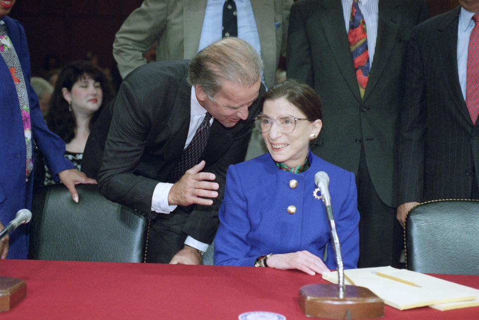 Sen. Joseph Biden, D-Del., chairman of the Senate Judiciary Committee, talks to Supreme Court nominee Judge Ruth Bader Ginsburg prior to the start of her confirmation hearing before the committee on Capitol Hill on Tuesday, July 20, 1993 in Washington. / Credit: John Duricka