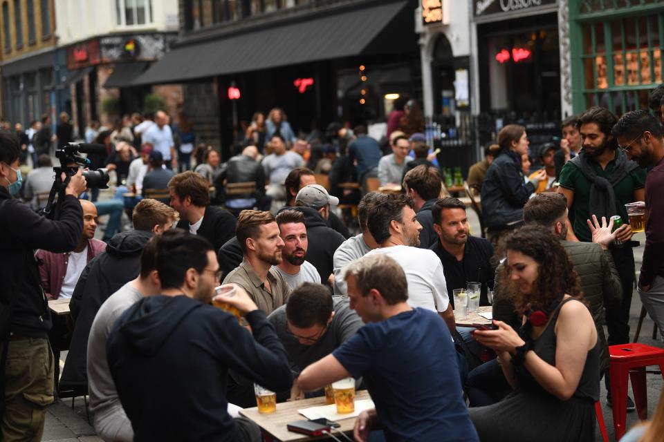 <p>Drinkers in Soho, London, in July</p> (PA)