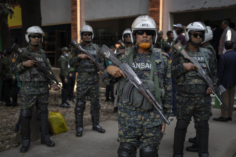 Security officers stand guard at a ballot boxes distribution centre in Dhaka, Bangladesh, Saturday, Jan. 6, 2024. Bangladesh’s main opposition party has enforced a 48-hour general strike from Saturday across the South Asian nation as the nation is ready to hold its next general election a day later. (AP Photo/Altaf Qadri)