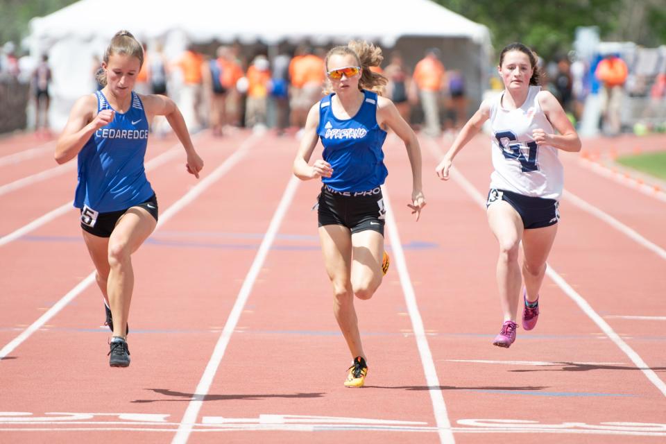 Swallows Charter Academy's Kaitlyn Pearson, center, heads to the finish line during the Class 2A 100 meter dash qualifier at the state track and field meet on Thursday, May 19, 2022 at Jeffco Stadium.