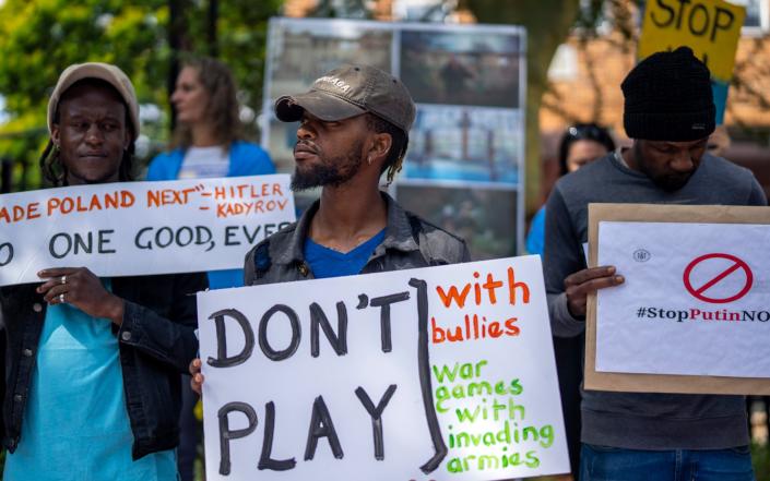 South African nationals join Ukrainians as they demonstrate outside the Russian Embassy, in Pretoria - Jerome Delay/AP