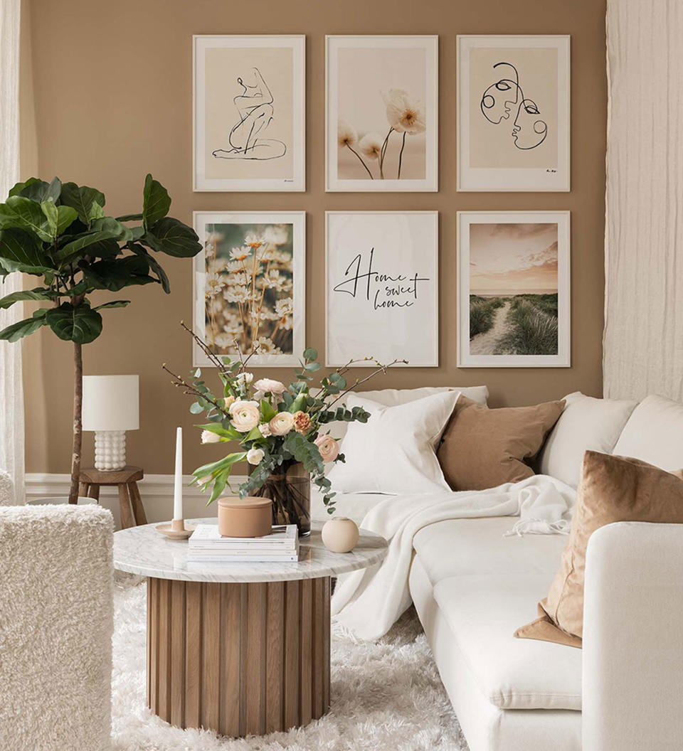 beige living room with picture gallery and neutral sofa