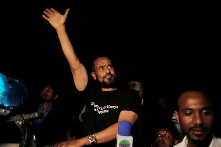 FILE PHOTO: Bekele Gerba, secretary general of the Oromo Federalist Congress (OFC), waves to his supporters during the celebration after his release from prison in Adama town of Oromia region, Ethiopia February 13, 2018. Picture taken February 13, 2018. REUTERS/Tiksa Negeri/File Photo