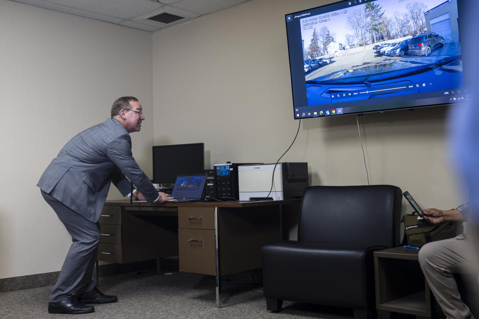 Kent County Prosecutor Chris Becker plays dashcam footage is shown to the media from the death of Riley Doggett, 17, Tuesday, May 28, 2024, in Grand Rapids, Mich. Doggett was killed by a Kent County patrol vehicle on April 8, 2024, in Wyoming, Michigan. (Joel Bissell/Kalamazoo Gazette via AP)