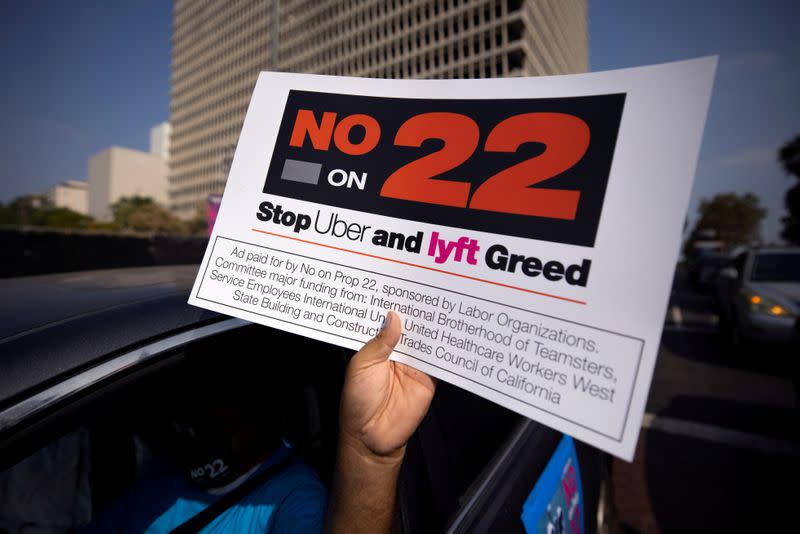 FILE PHOTO: App-based gig workers hold demonstration outside Los Angeles City Hall to urge voters to vote no on Proposition 22 in California