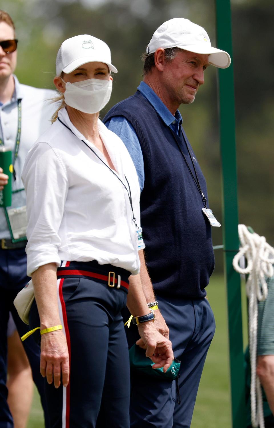 Wayne Gretzky and his wife, Janet, watch Dustin Johnson on No. 13 during Thursday's first round for the Masters at Augusta National Golf Club, Thursday, April 8, 2021, in Augusta, Georgia.