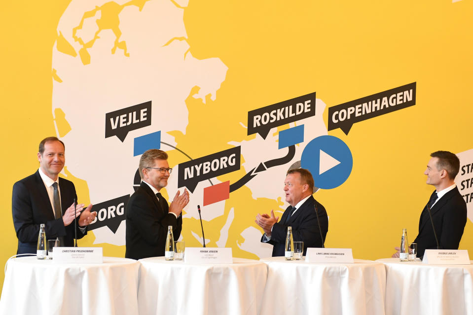 During a Tour de France press conference, with from left, Tour de France Director Christian Prudhomme, Mayor of Copenhagen Frank Jensen, Prime Minister Lars Loekke Rasmussen and Business Minister Rasmus Jarlov, hold a press conference on the Tour de France at Copenhagen City Hall, Thursday Feb. 21, 2019. The Tour de France has announced that the cycle race in 2021 will start in Denmark. (Mads Claus Rasmussen / Scanpix 2019 via AP)