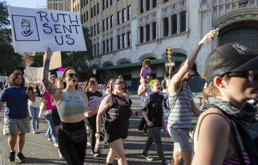 SAN ANTONIO, TX- JUNE 24, 2022: Hundreds of protesters marched in 100 degree heat downtown against the Supreme Court's decision to overturn Roe v. Wade on June 24, 2022 in San Antonio, Texas.(Gina Ferazzi / Los Angeles Times)