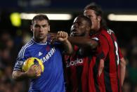 Chelsea's Branislav Ivanovich (L), West Bromwich Albion's Victor Anichebe (C) and Jonas Olsson clash during their English Premier League soccer match at Stamford Bridge in London November 9, 2013.