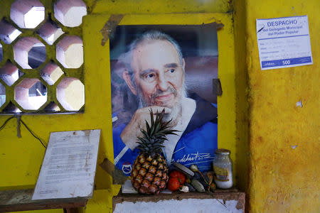 A poster of Cuba's late President Fidel Castro is seen at a state-run store in Havana, Cuba April 18, 2018. REUTERS/Stringer NO RESALES. NO ARCHIVES.