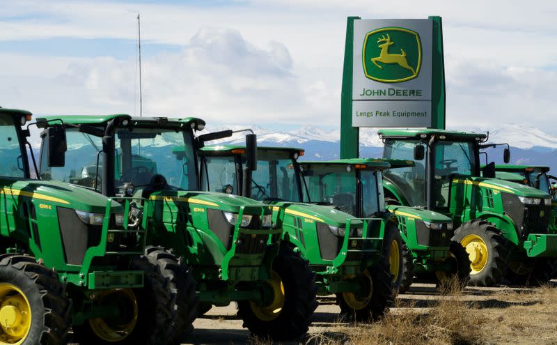 FILE PHOTO: John Deere tractors are seen for sale at a dealer in Longmont