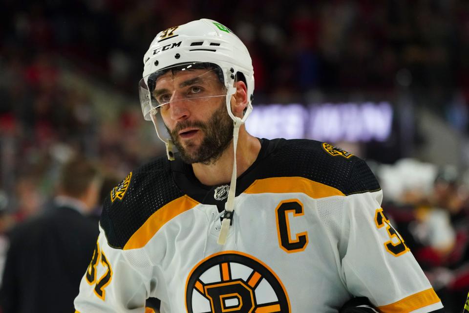Boston Bruins center Patrice Bergeron, seen here during the 2022 Stanley Cup Playoffs against Carolina, has signed an incentive-laden one-year contract to skate again for the Boston Bruins in 2022-23.
