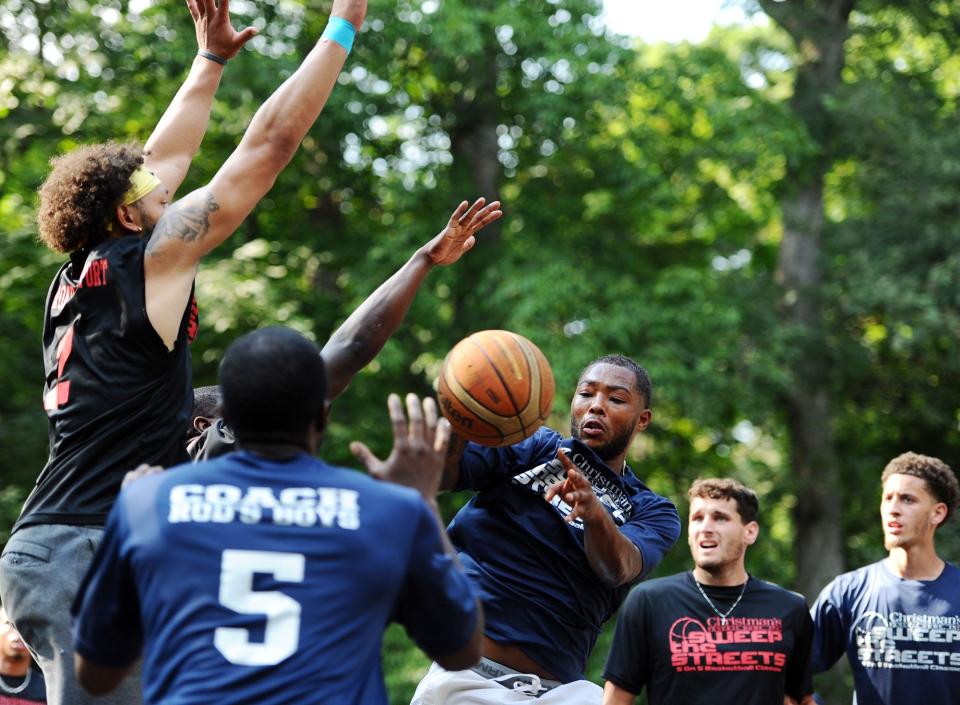 Players fight for a loose ball during action at Sweep The Streets last year at Coleman Park.