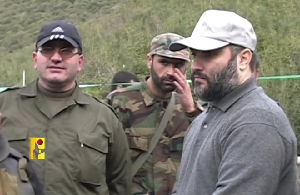 In this undated picture released by Hezbollah Military Media, shows senior Hezbollah commander Wissam Tawil, centre, who was killed in Kherbet Selem village, south Lebanon, on Monday, Jan. 8, 2024, standing next of slain top Hezbollah military commander Imad Mughniyeh, right, who was assassinated in Syria on February 2008. An Israeli airstrike killed Tawil, who is an elite Hezbollah commander in southern Lebanon, the latest in an escalating exchange of strikes along the border that have raised fears of another Mideast war even as the fighting in Gaza exacts a mounting toll on civilians. (Hezbollah Military Media, via AP)