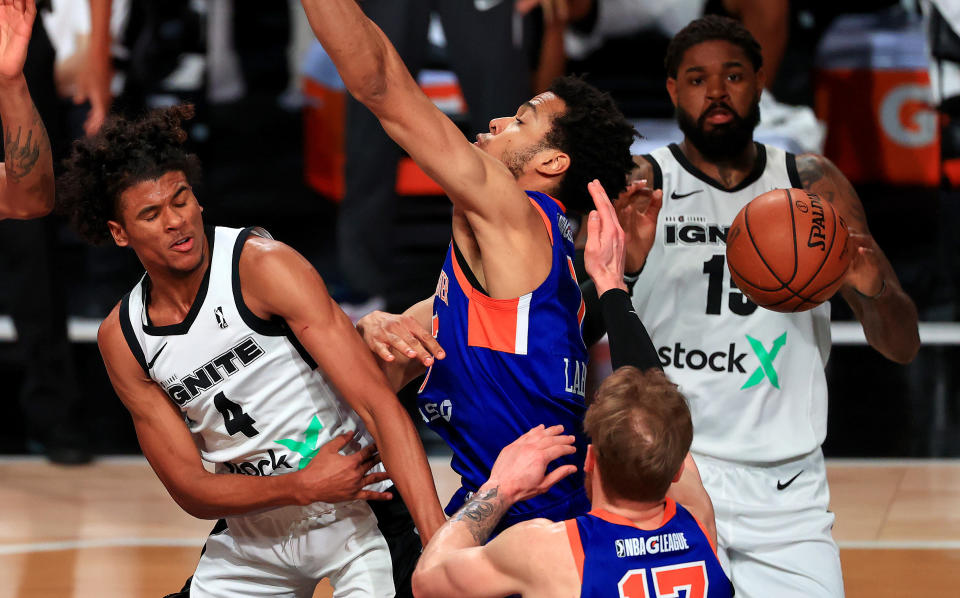 Jalen Green #4 of the G League Ignite passes around  Louis King #2 of the Westchester Kicks during a G-League game against the Westchester Knicks at AdventHealth Arena at ESPN Wide World Of Sports Complex on February 18, 2021 in Lake Buena Vista, Florida. (Photo by Mike Ehrmann/Getty Images) NOTE TO USER: User expressly acknowledges and agrees that, by downloading and or using this photograph, User is consenting to the terms and conditions of the Getty Images License Agreement.