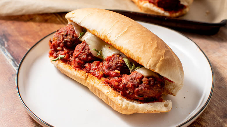 Meatball sub on white plate