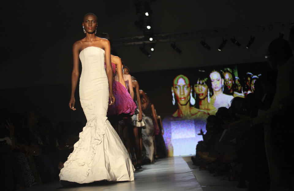 A model displays an outfit by designer Frank Osodi of Nigeria at the ARISE Fashion Week event in Lagos, Nigeria on Sunday, March 11, 2012. (AP Photos/Sunday Alamba)