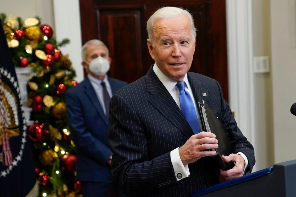 President Joe Biden answers a question as he speaks about the COVID-19 variant omicron, in the Roosevelt Room of the White House, Monday, Nov. 29, 2021, in Washington. Dr. Anthony Fauci, director of the National Institute of Allergy and Infectious Diseases and chief medical adviser to the president, listens at left.