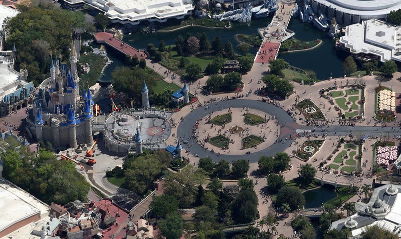 FILE PHOTO: Crowds walk along Main Street inside Disney's Magic Kingdom on the final day before closing in an effort to combat the spread of coronavirus disease (COVID-19) in Orlando