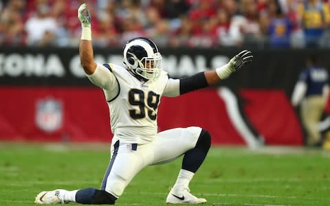 Los Angeles Rams defensive tackle Aaron Donald (99) celebrates a second half sack against the Arizona Cardinals at State Farm Stadium - Credit: USA TODAY
