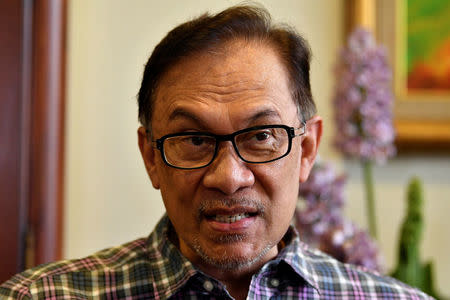 Malaysian politician Anwar Ibrahim speaks to Reuters during an interview at his house in Kuala Lumpur, Malaysia May 17, 2018. REUTERS/Stringer