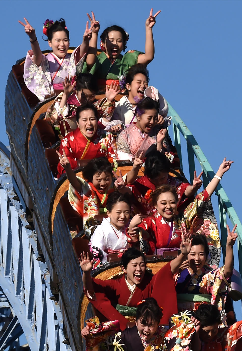 Twenty-year-old Japanese women dressed in kimonos take a ride on a roller-coaster after their "Coming-of-Age Day" celebration ceremony at Toshimaen amusement park in Tokyo on January 14, 2019. (Photo by Kazuhiro NOGI / AFP)        (Photo credit should read KAZUHIRO NOGI/AFP via Getty Images)