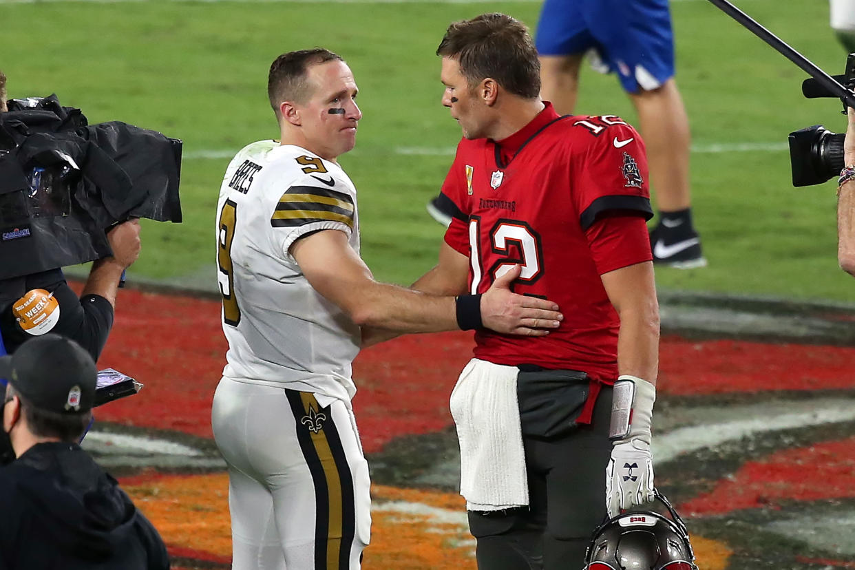 TAMPA, FL - NOVEMBER 08: Two of the greatest quarterbacks in NFL history Drew Brees (9) of the Saints and Tom Brady (12) of the Buccaneers share a few words of encouragement after the regular season game between the New Orleans Saints and the Tampa Bay Buccaneers on November 08, 2020 at Raymond James Stadium in Tampa, Florida. (Photo by Cliff Welch/Icon Sportswire via Getty Images)