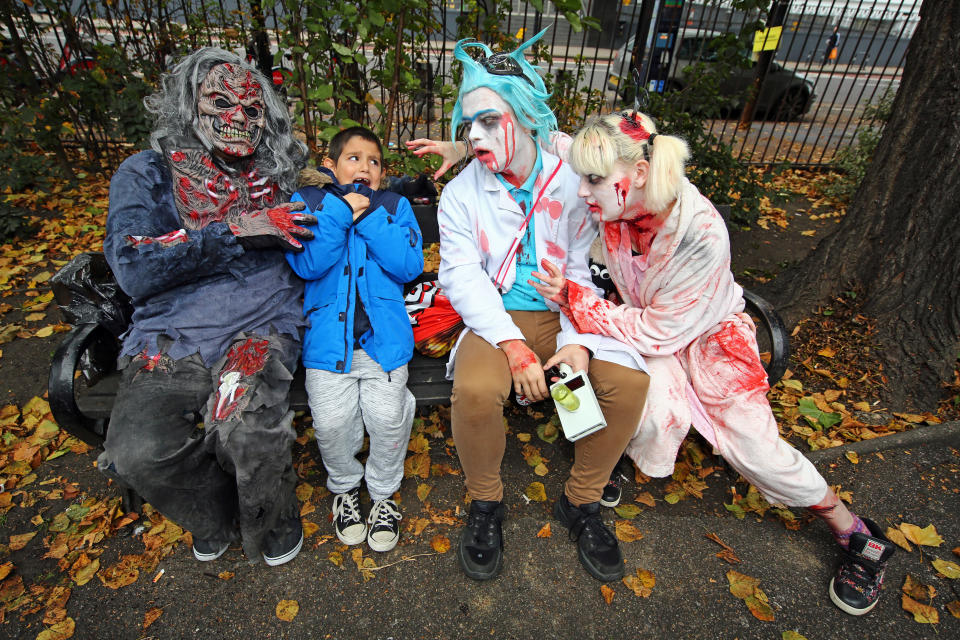 <p>Participants dressed as zombies wander through London on a pub crawl for World Zombie Day to aid homeless charity St. Mungos World Zombie Day in London on Oct. 7, 2017. (Photo: Paul Brown/REX/Shutterstock) </p>