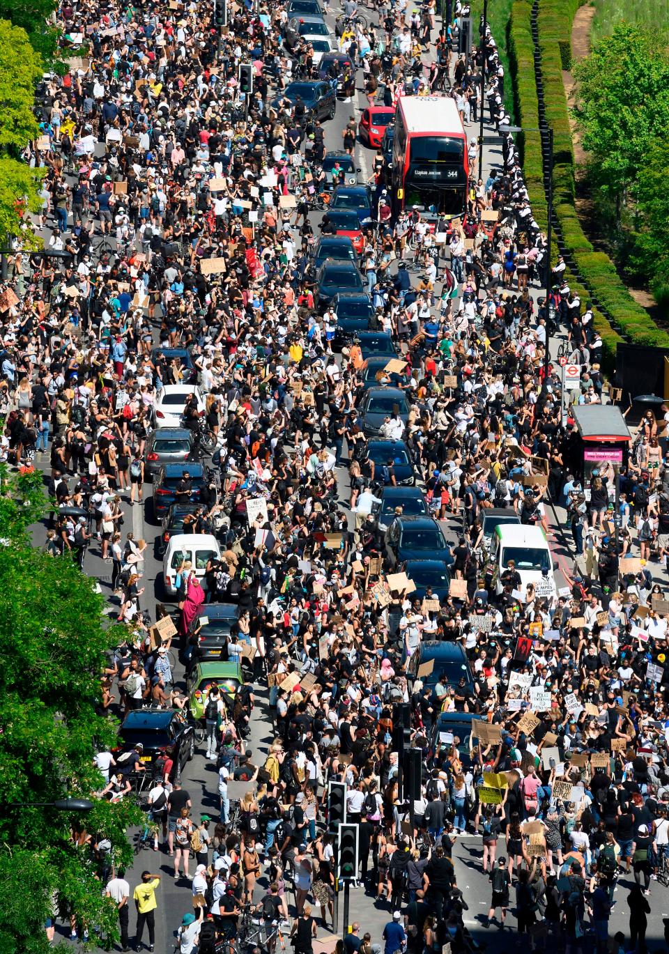 Demonstrators block a road outside the U.S. Embassy in London on May 31 to protest the death of George Floyd, an unarmed black man who died after a police officer knelt on his neck for nearly nine minutes during an arrest in Minneapolis.