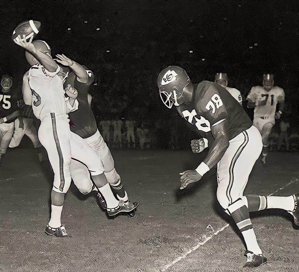 Kansas City Chiefs star Bobby Bell, right, zeroes in on Denver Broncos quarterback Jacky Lee as the Chiefs’ Smokey Stover rushes him hard at the Chiefs’ 35-yard line in Kansas City’s 14-10 exhibition victory over the Broncos Aug. 28, 1964, at Farrington Field in Fort Worth.