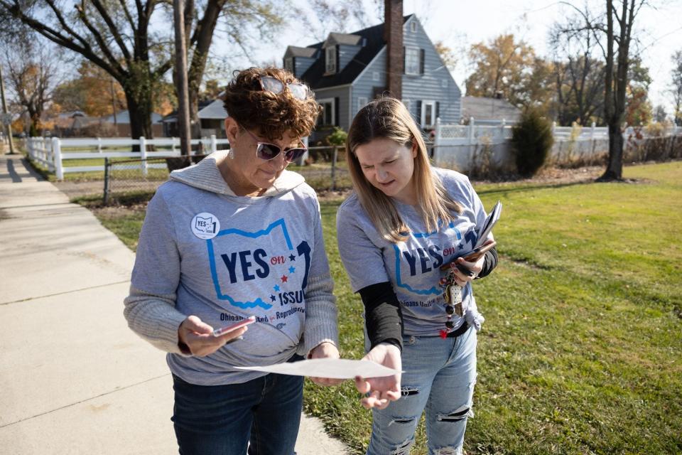 Pro-Choice canvasser Summer McLain, 27, and her mother Lorie McLain, 61, look at a map of a neighborhood before canvassing ahead of the general election in Columbus, Ohio on November 5, 2023.