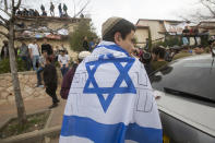 <p>Israeli settlers gathering next to a house as Israeli police evict settlers from the West Bank settlement of Ofra, Tuesday, Feb. 28, 2017. EPA/ATEF SAFADI </p>