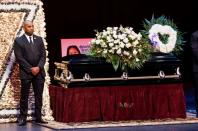 A man stands guard next to the casket for late rapper Marcel Theo Hall, known by his stage name Biz Markie, during the funeral service in Patchogue, New York