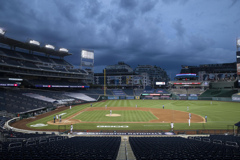 Clouds move in during the fourth inning of an opening day baseball game between the Washington Nationals and the New York Yankees at Nationals Park, Thursday, July 23, 2020, in Washington. (AP Photo/Alex Brandon)