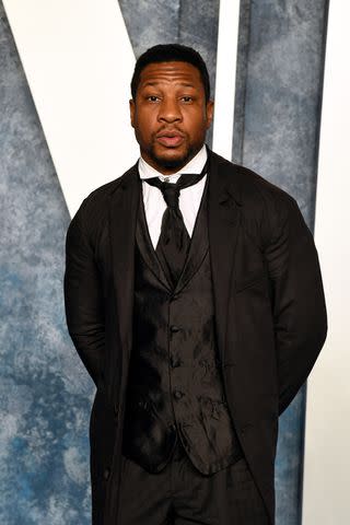 <p>Jon Kopaloff/Getty</p> Jonathan Majors attends the 2023 Vanity Fair Oscar Party Hosted By Radhika Jones at Wallis Annenberg Center for the Performing Arts on March 12, 2023 in Beverly Hills, California.