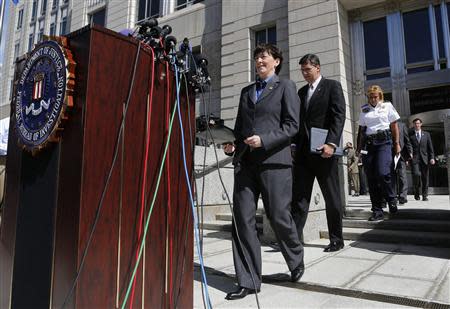 Assistant Director in Charge of the FBI's Washington Field Office Valerie Parlave (L) walks out to host a news conference to share the findings about the investigation into the shootings at the Navy Yard last Monday at the FBI's Washington Field Office in Washington, September 25, 2013. REUTERS/Larry Downing