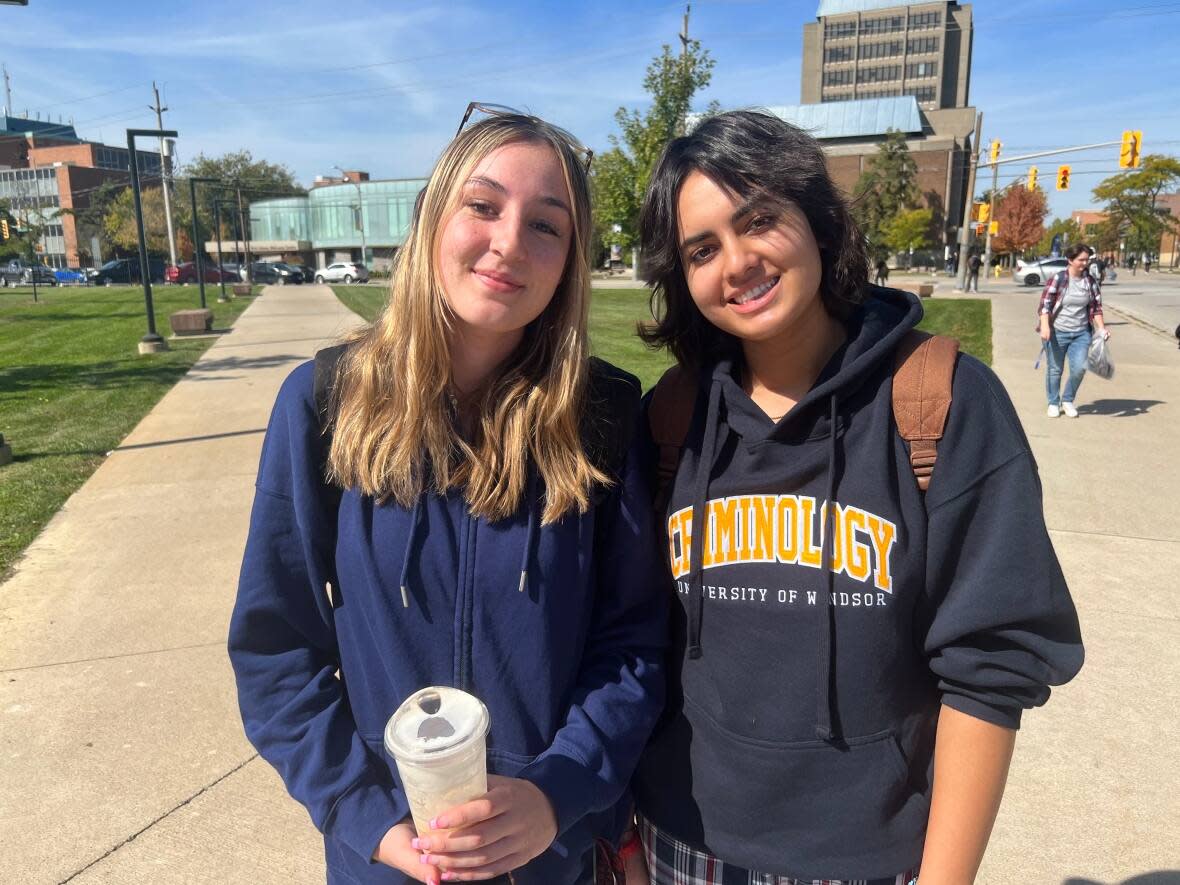 University of Windsor students Makenna Vistany and Noor Sandhu said they feel safe on campus at night because they're always together. (Jacob Barker/CBC - image credit)