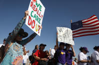 <p>People protest near the tent encampment recently built at the Tornillo-Guadalupe Port of Entry on June 24, 2018 in Tornillo, Texas. The group is protesting the separation of children from their parents after they were caught entering the U.S. under the administration’s zero tolerance policy. (Photo: Joe Raedle/Getty Images) </p>