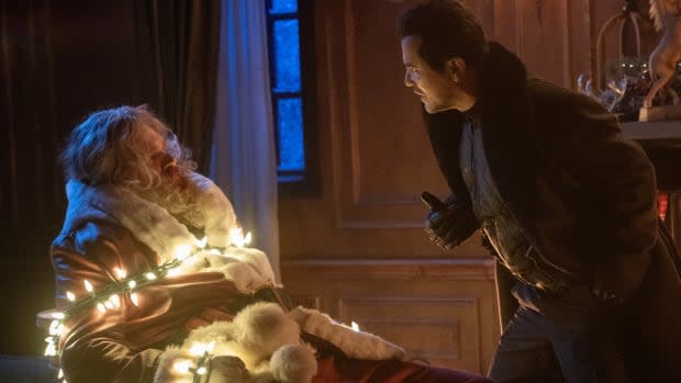 David Harbour as Santa Claus and John Leguizamo as Scrooge in "Violent Night"<p>Universal Pictures</p>