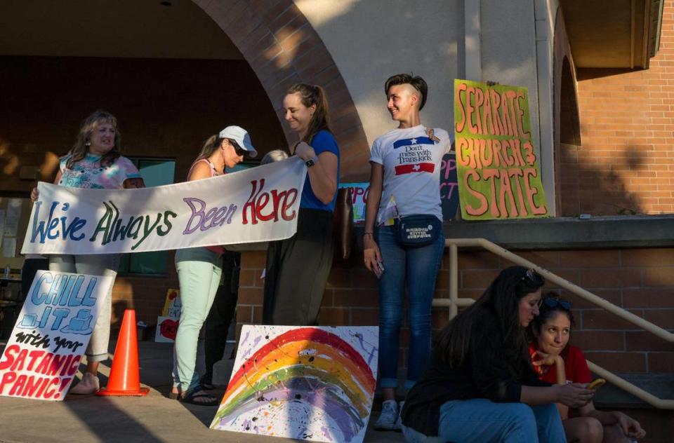 Marcie Johnson, center, of Rocklin, and Noel Leckemby, right, a local small-business owner, stand outside the Rocklin Unified School District Board meeting Wednesday in opposition to a policy requiring schools to possibly violate state law by “outing” transgender students to their parents. “I’m here supporting community members who have children in this school district,” Leckemby said. Johnson, who has two children in elementary school, added, “There hasn’t been a situation that happened in this district that’s been concerning enough … for these revisions that they’re wanting to make.”